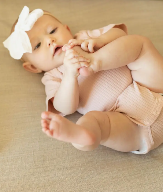 Powder Pink Ribbed Organic Onesie